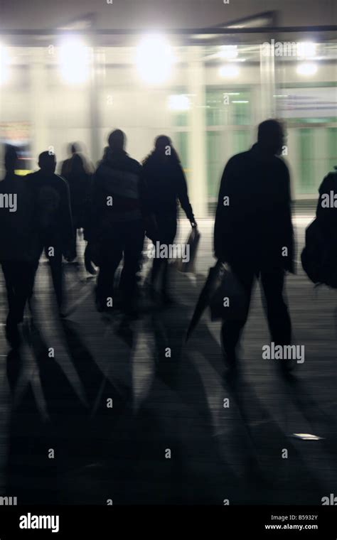 crowd of people walking in street at night Stock Photo - Alamy