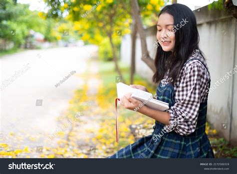 Young Girl Sitting On Bench Reading Stock Photo 2172500319 | Shutterstock