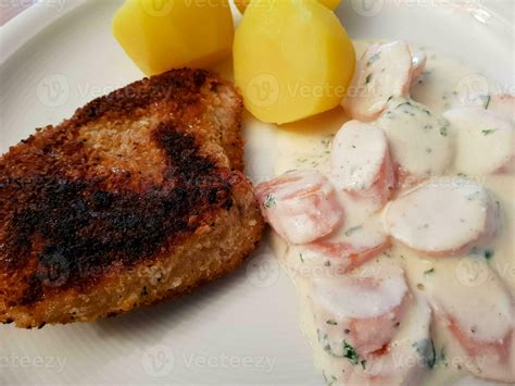 breaded wiener schnitzel with side dishes 24056141 Stock Photo at Vecteezy