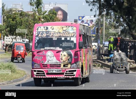 KENYA, Nairobi, Graffiti street art and traffic, colorful painted SACCO mini bus Matatu / KENIA ...