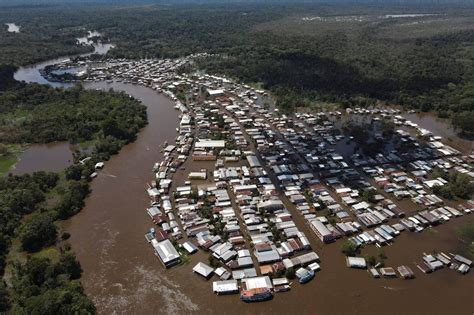 In pictures: Rising Amazon rivers flood Covid-hit areas in Brazil - BBC ...