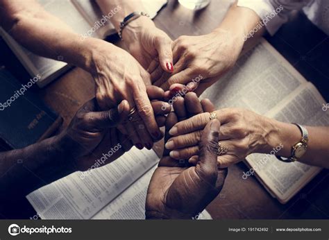 People Praying Together Holding Hands