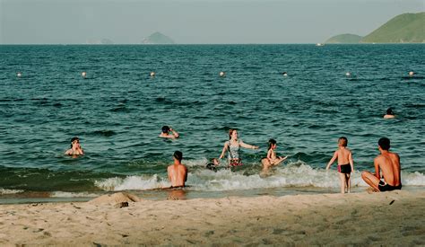 Photography of People Swimming in the Beach · Free Stock Photo