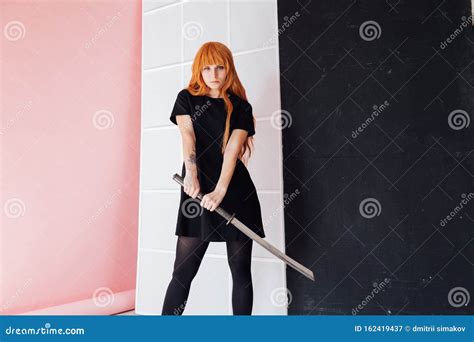 Girl Sword Japan Cosplayer Anime Red Hair Royalty-Free Stock Photo | CartoonDealer.com #162419397