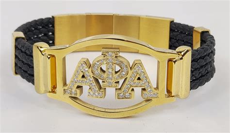 ALPHA GOLD S. S. & LEATHER CRYSTAL BRACELET