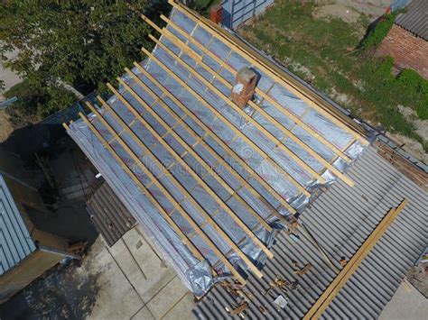 Repair of the Roof of the House. Moisture Insulation Under Metal. Editorial Photo - Image of ...