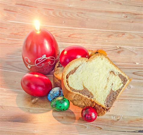 Cakes Cozonac With Smashed Nuts, Traditional Colored Easter Egg, Candle, Wood Background Stock ...