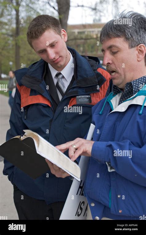 Street Preacher Debates Mormon Missionary Stock Photo - Alamy