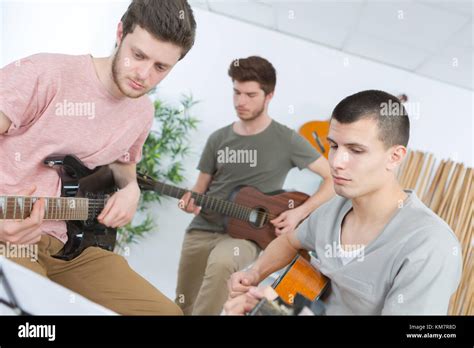 friends playing music Stock Photo - Alamy