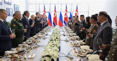 Vladimir Putin and Kim Jong-un Exchanges Rifles During Military Summit