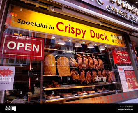 CRISPY PEKING DUCK SOHO Restaurant Window display hanging air drying in ...