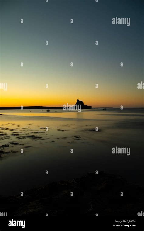 Holy Island (Lindisfarne) Castle sunrise Stock Photo - Alamy