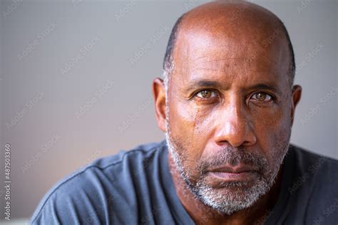 Portrait of a mature man looking sad with tears in his eyes. Stock ...