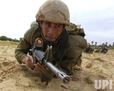 Photo: An Israeli soldier crawls during a training exercise along the ...