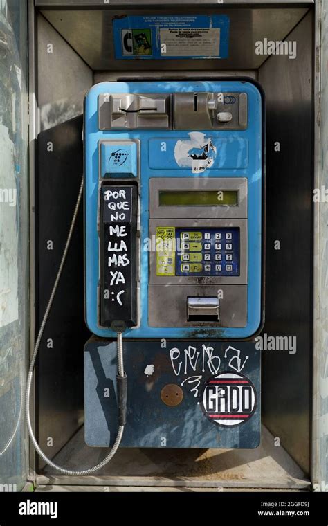 old phone booth broken and full of graffiti Stock Photo - Alamy