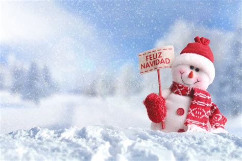 Snowman with a Placard Feliz Navidad on the Snow Stock Photo - Image of ...