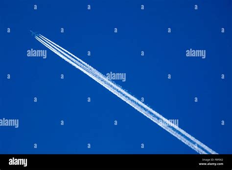 Airplane and Vapor Trail. Germany Stock Photo - Alamy