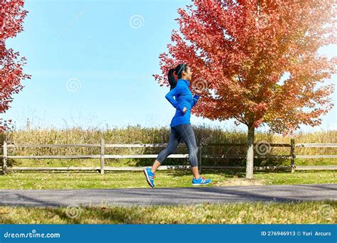 Youre Getting Close To Your Goals. a Sporty Young Woman Running Outdoors. Stock Image - Image of ...