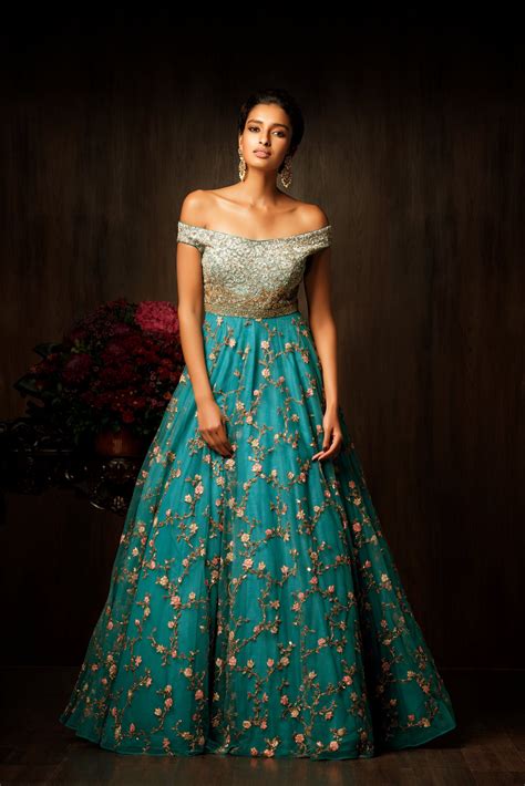 A truly magnificent pagoda blue gown, with an off shoulder bodice which is entirely done in ...