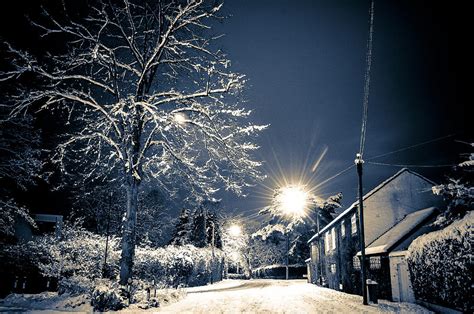 Snowy street scene at night, Hale Barns, Cheshire, UK Photograph by Neil Alexander Photography ...