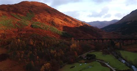 Aerial Drone Sunrise flyover of Glenfinnan Viaduct, Nature Stock Footage ft. attraction & valley ...