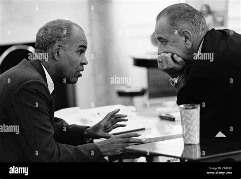 President Lyndon Johnson listening to NAACP leader Roy Wilkins in Oval ...