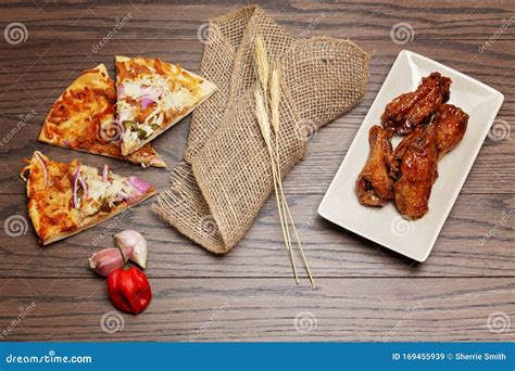 Pizza and wings flatlay stock image. Image of cooking - 169455939