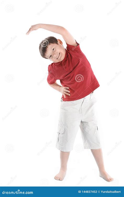 Little Boy Performs an Exercise To Stretch the Muscles.isolated on ...