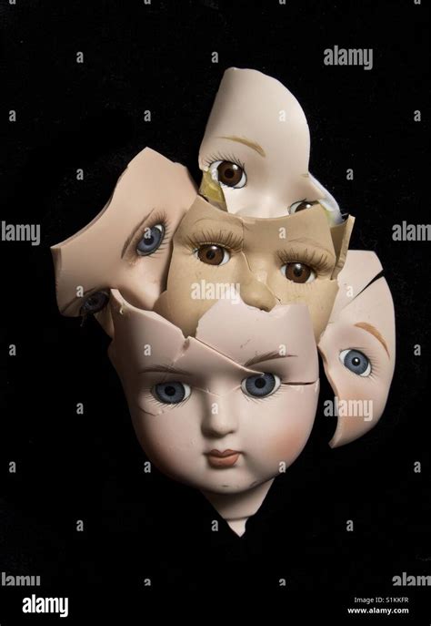 Broken doll faces and head Stock Photo - Alamy