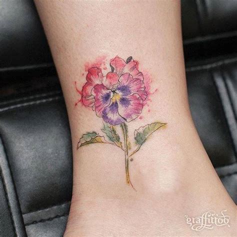 Sketchy pansy tattoo on the ankle.