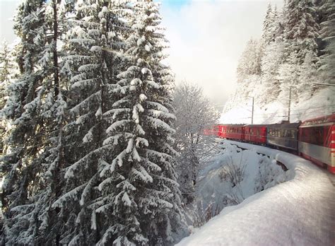 Swiss Train Travelling through Alps in Winter - a photo on Flickriver