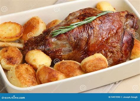 Roast Leg Of Lamb With Potatoes Stock Photo - Image: 9497090