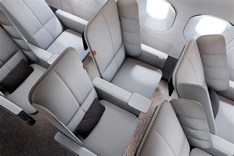 Plane seats with padded ‘privacy panels’ that double as a headrest ...