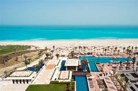 View of St. .Regis Saadiyat's pool area and beachfront. Luxury Beach ...