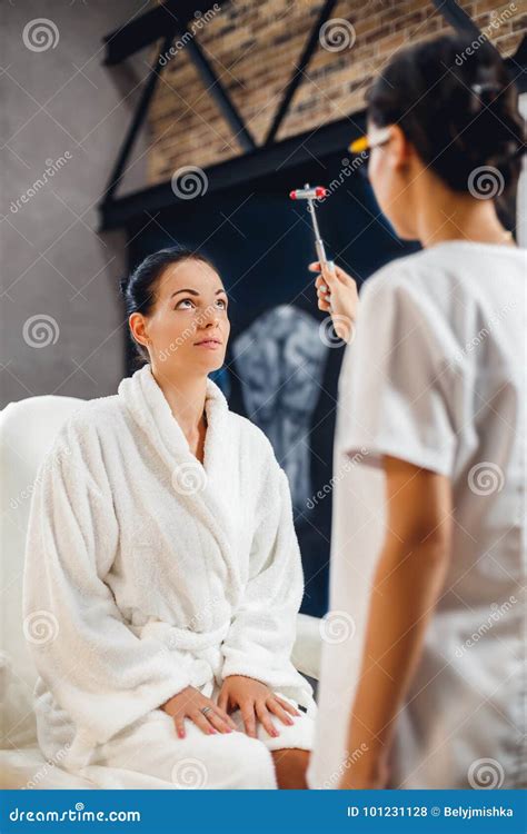 Doctor Checking Reflexes of His Patient with Reflex Hammer. Stock Photo ...