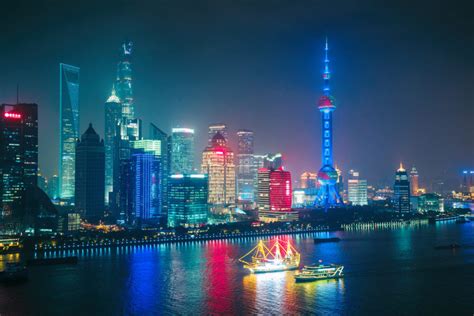 Aerial panoramic view over a big modern city by night. Shanghai, China ...