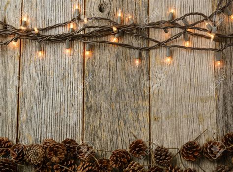 Christmas Lights and Pine cones on Rustic Wood Background | Rustic wood background, Wood ...