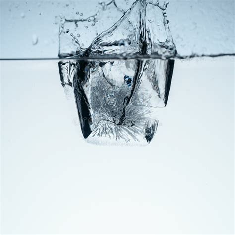 Ice Cube in Water with Splash Stock Image - Image of simple, simplicity: 108790175