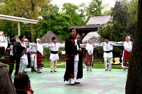 Traditional Romanian costumes at a folklore concert | Travel Moments In Time