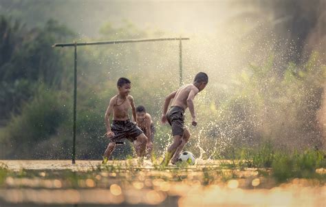 Three boy playing soccer on green grass field HD wallpaper | Wallpaper Flare