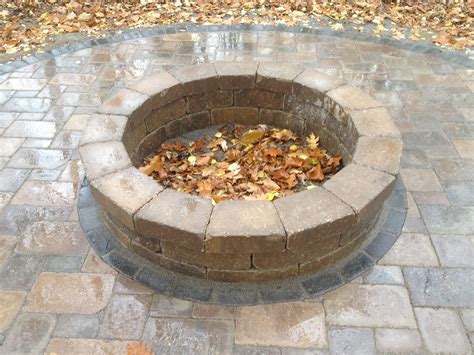 Fire Pit in the woods...Brick paver patio and tumbled paver stone fire ...