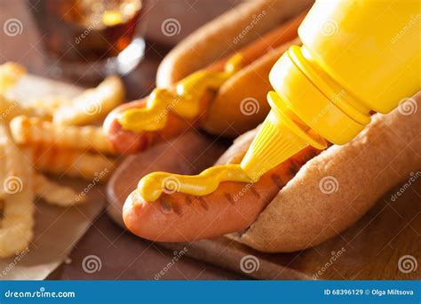 Adding Mustard To Grilled Hot Dog Stock Image - Image of bread, glass: 68396129