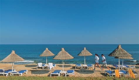 Aldemar Knossos Royal Beach Hotel is bathed in sunlight, calmed by the gentle waves of the ...