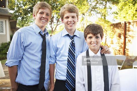 Portrait Of 3 Young Brothers Smiling High-Res Stock Photo - Getty Images