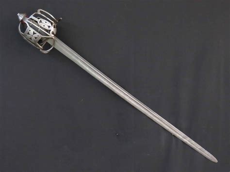 Basket Hilted Scottish Back Sword with wrigglework to Hilt Circa 1730 – Alban Arms & Armour