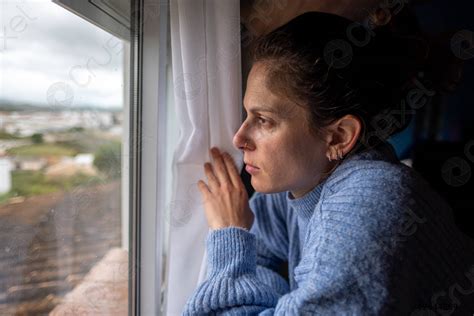 Sad woman looking out the window - stock photo 2644289 | Crushpixel