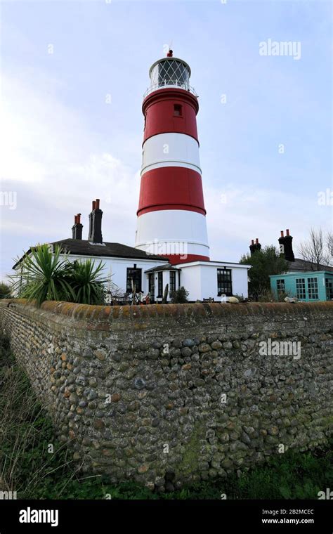 Sunset over Happisburgh Lighthouse, Happisburgh village, North Norfolk Coast, England, UK its ...