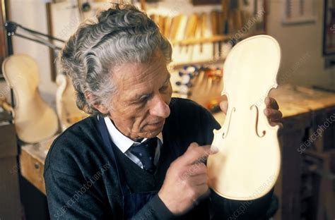 Violin-maker at work - Stock Image - C024/6176 - Science Photo Library