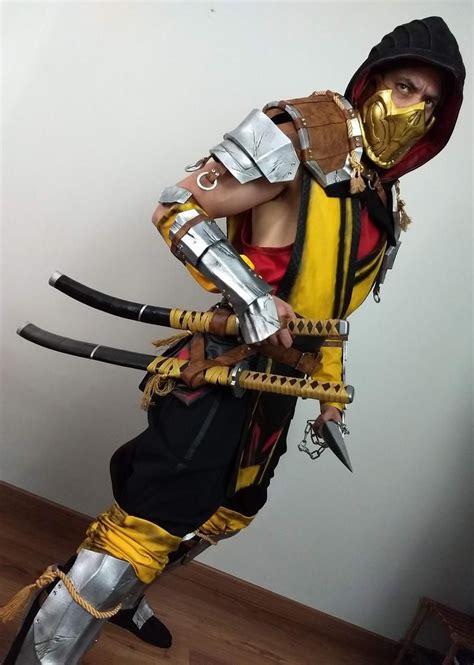 a man dressed up as a warrior with two swords in his hands and wearing ...