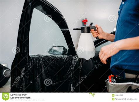 Male Hand with Spray, Car Window Tint Installation Stock Image - Image ...